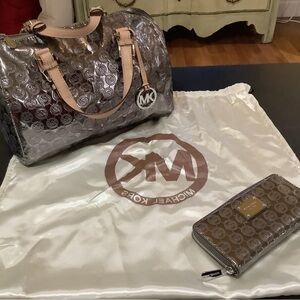 Michael Kors satchel w/matching wallet and dust bag. Silver metallic lining.